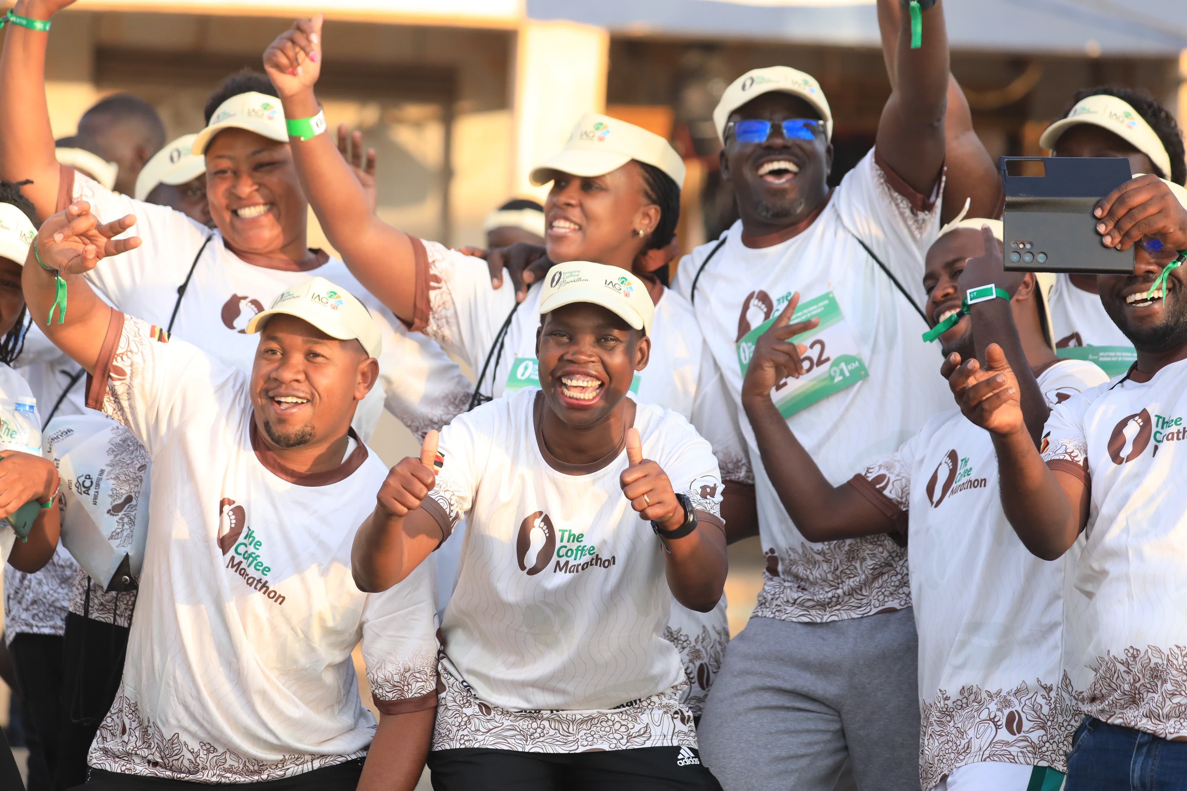 Community runners celebrating — Coffee Marathon 2025